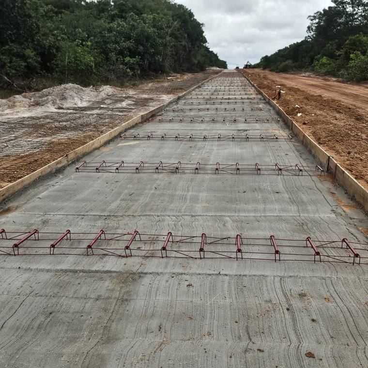Ready-mix concrete road pour with dowel baskets